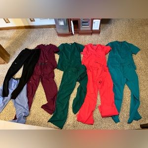 Women’s extra small Sanibel scrubs. Four outfits and two pairs of pants.